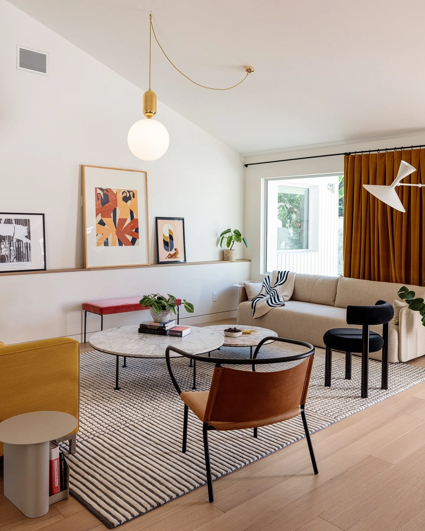 12. Modern Artistic Lounge in Mustard and Black Accents (Open Space Living Room Ideas)