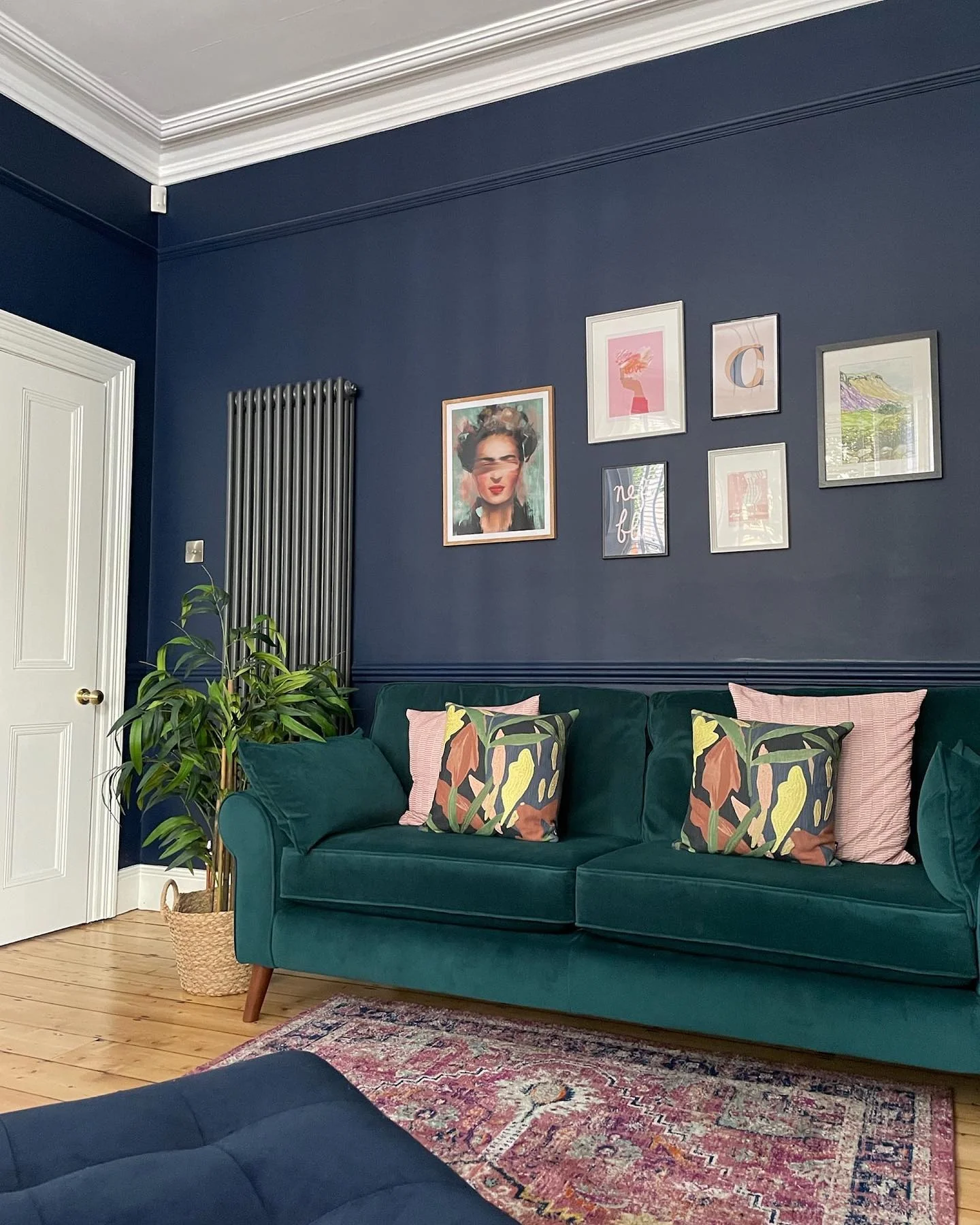 6. Cosy Blue Living Area With Floral Tile Fireplace (Victorian Living Room Ideas)