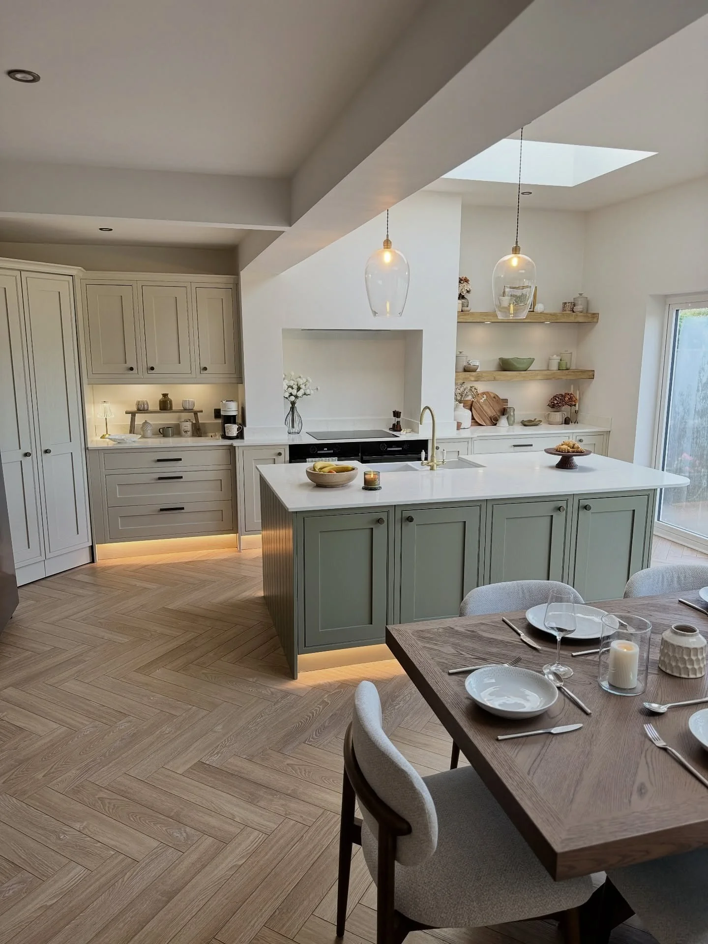 10. Sage and Cream Blend with Under-Cabinet Glow (Open Plan Kitchen Ideas)