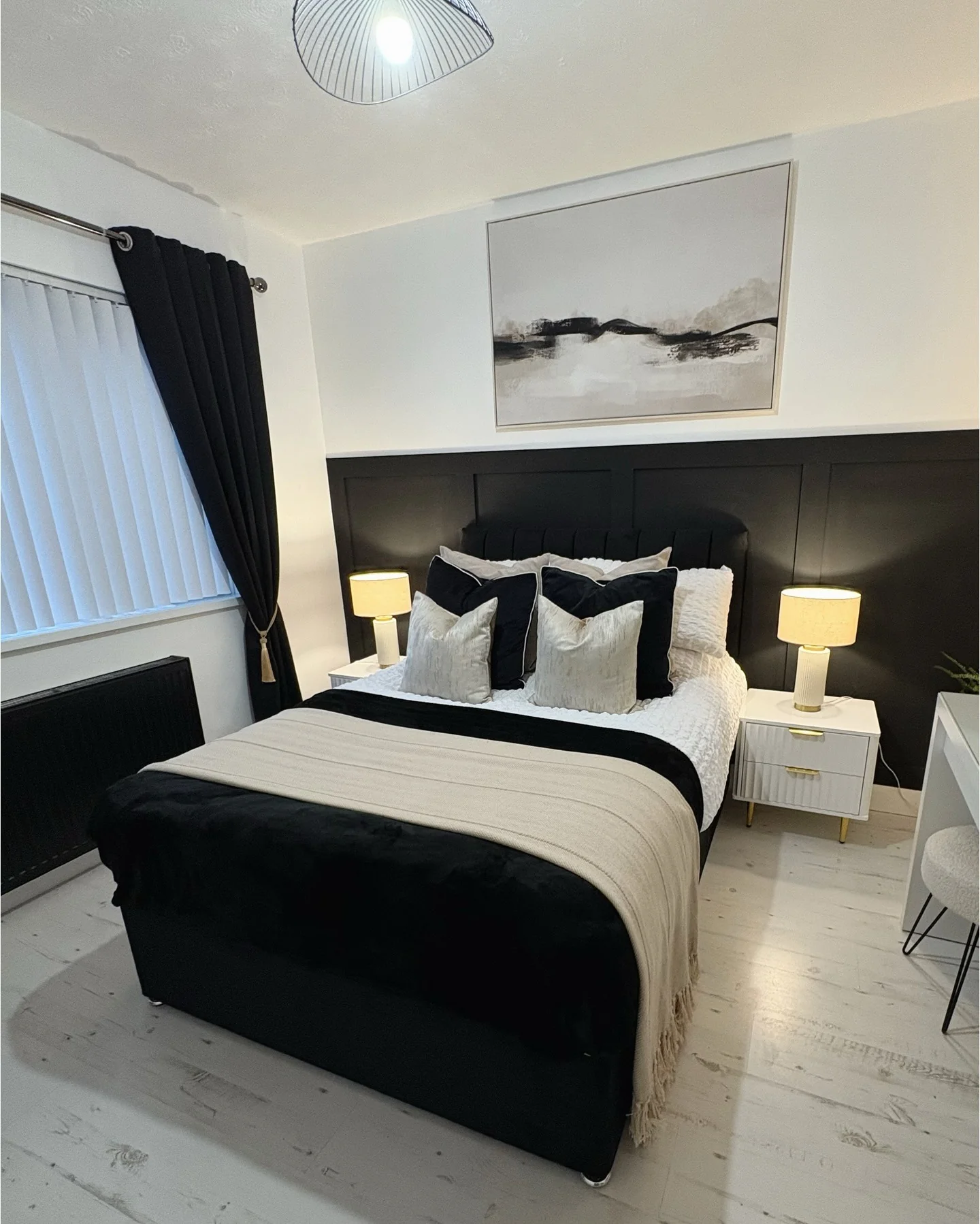 11. Black Wainscot Feature Wall with Layered Neutrals (Bedroom Ideas with Black Furniture)