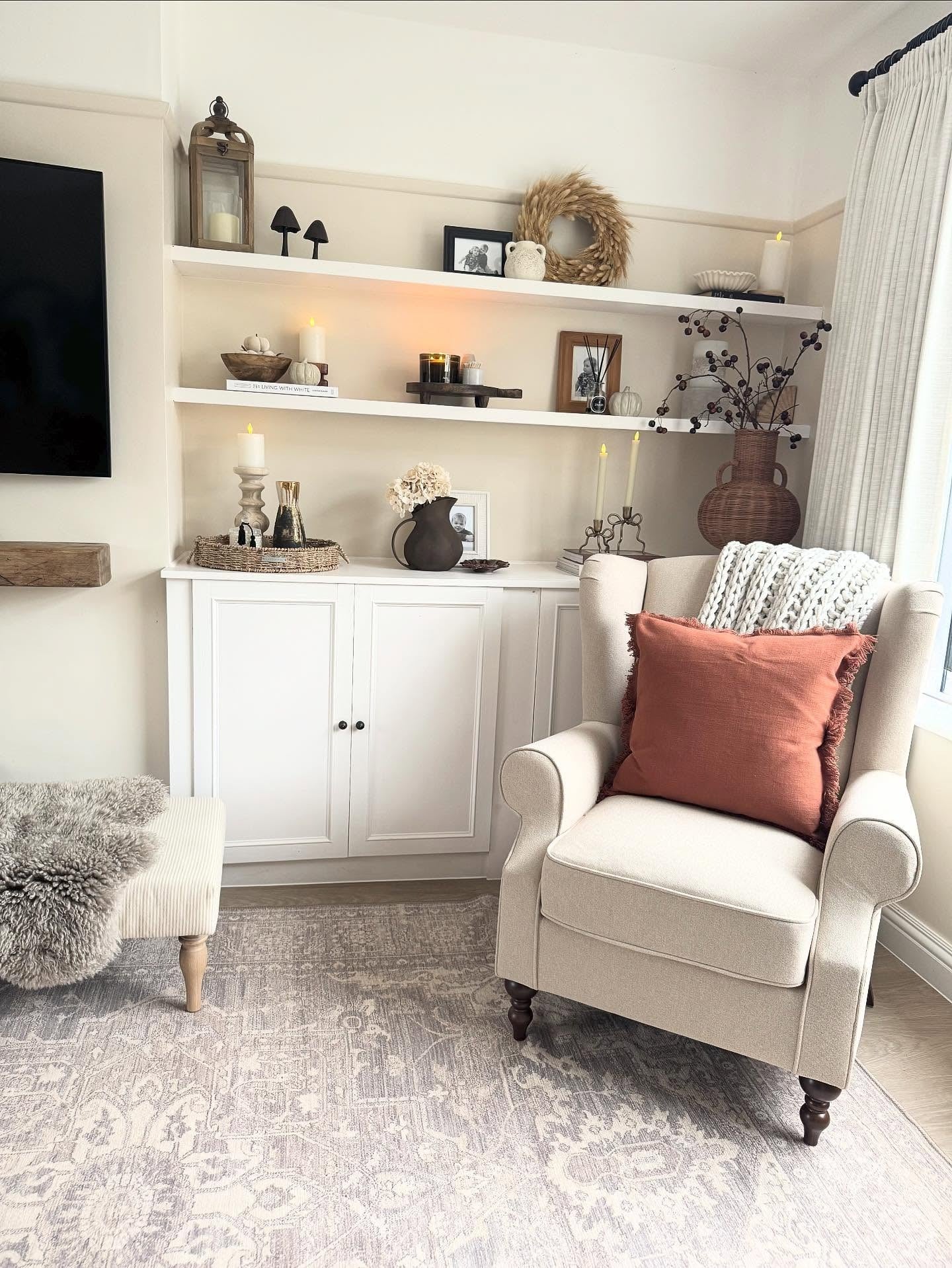 7. Neutral Reading Corner With Built-In Shelving and Soft Lighting (Living Room Decor Ideas)