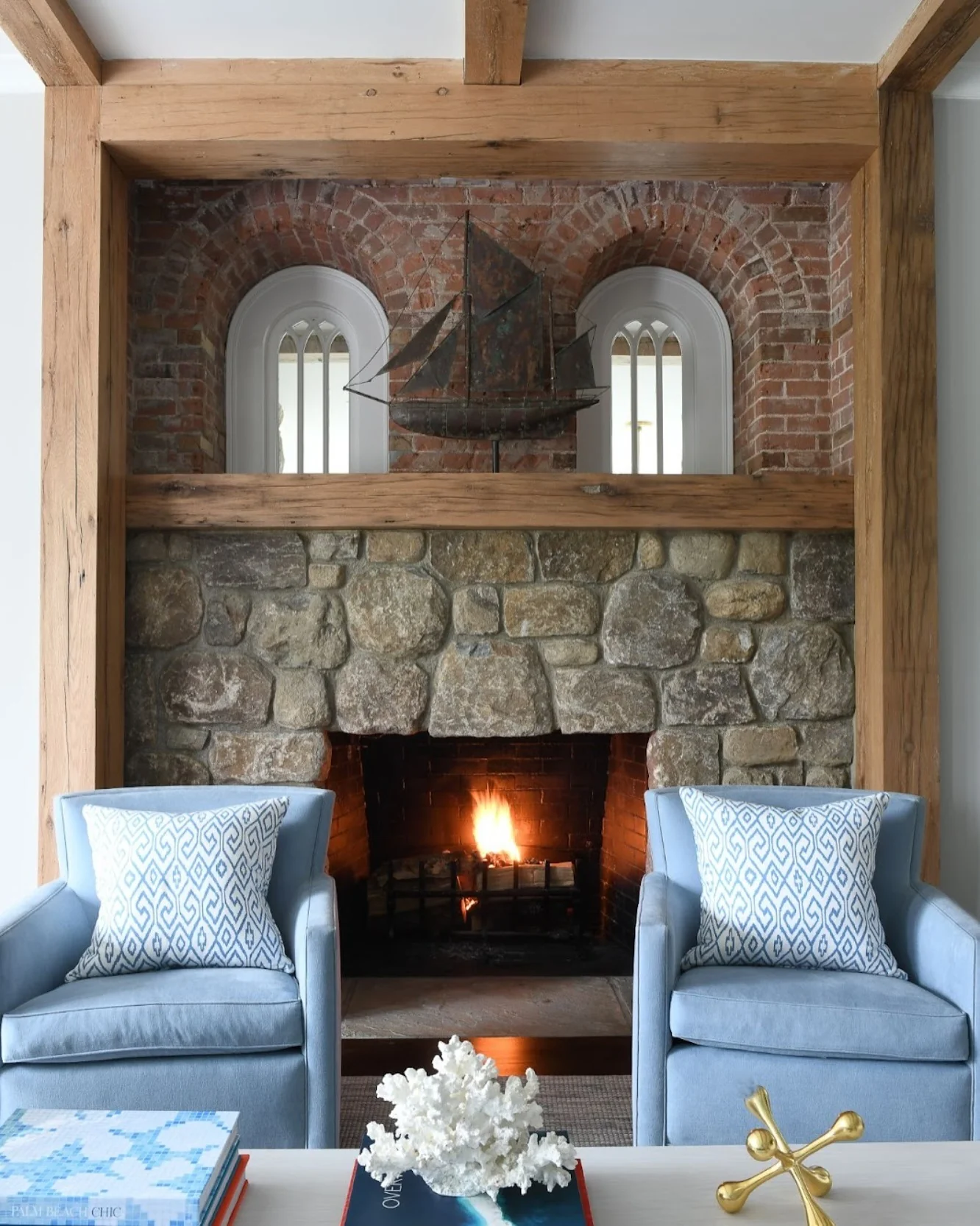 11. Coastal-Inspired Stone Hearth with Soft Blues (Stone Fireplace Living Room Ideas)