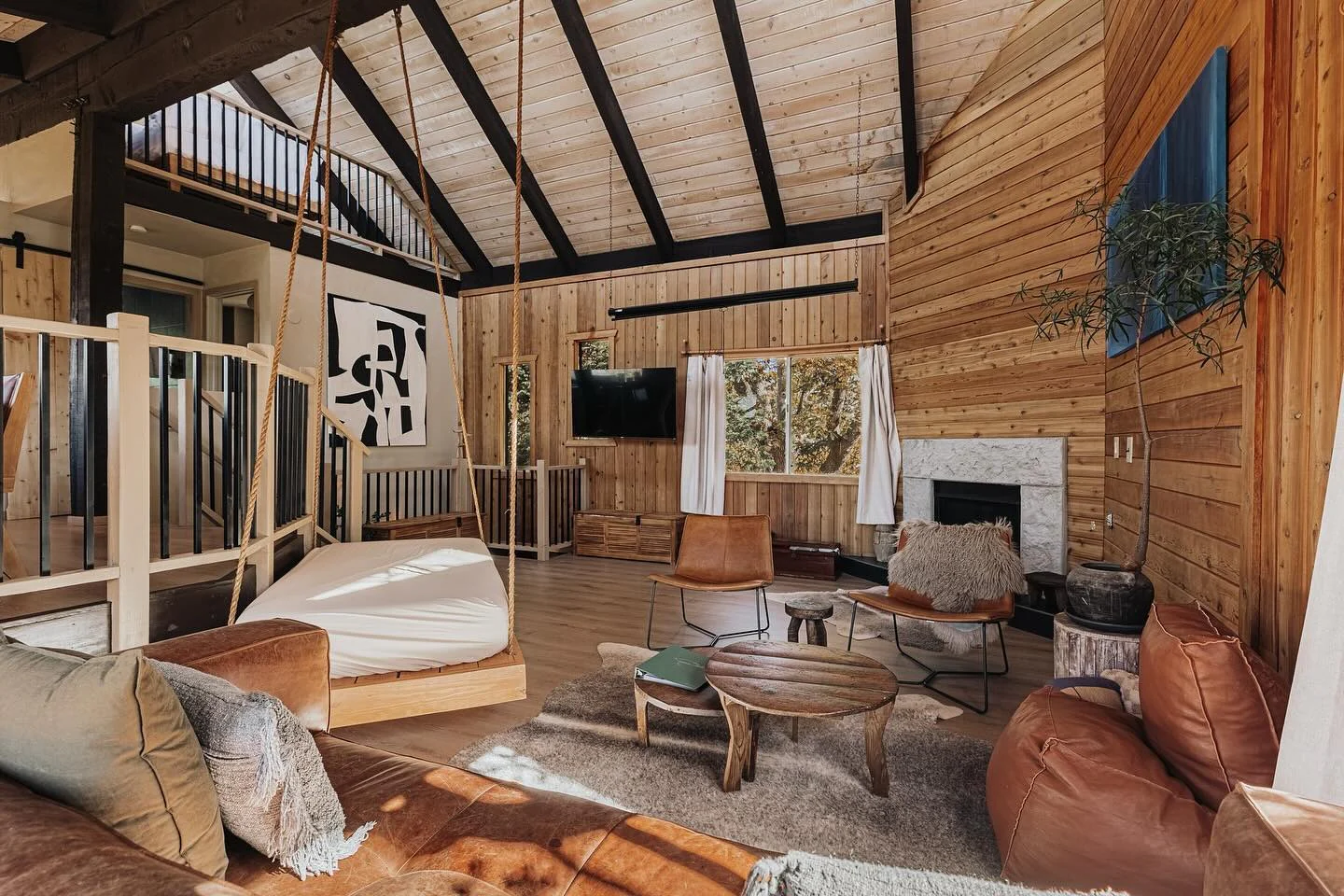 2. Modern Woodland Loft with Swing Daybed & Natural Timber Tones (Cabin Living Room Ideas)