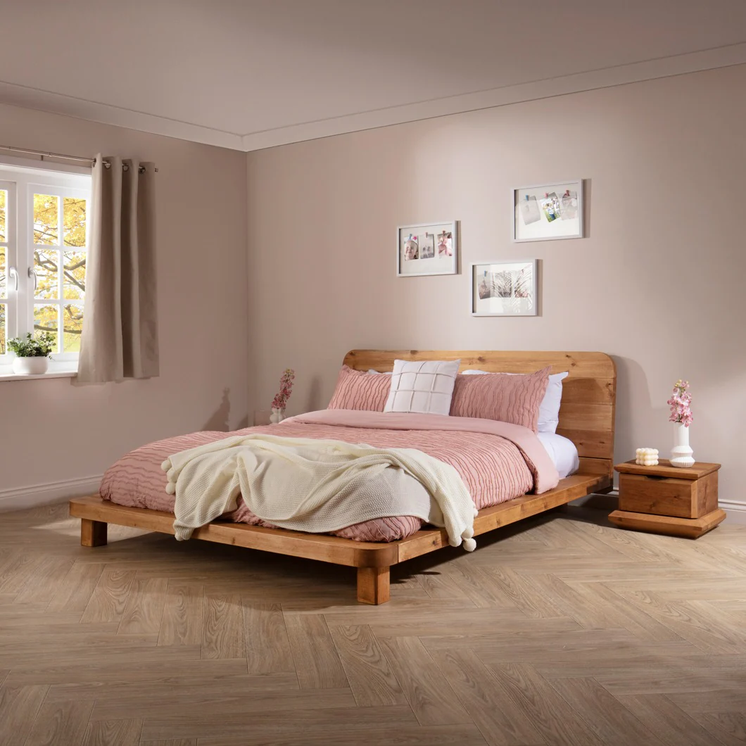 14. Low Oak Platform Bed with Blush Bedding (Oak Bedroom Ideas)
