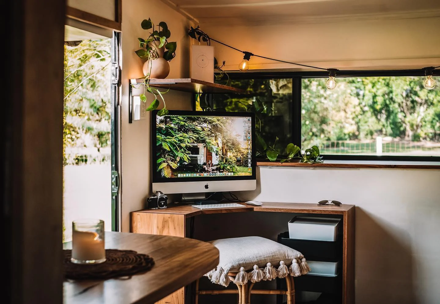 13. Corner Office with Warm Wood and Lush Greenery (Tiny Home Office Ideas)