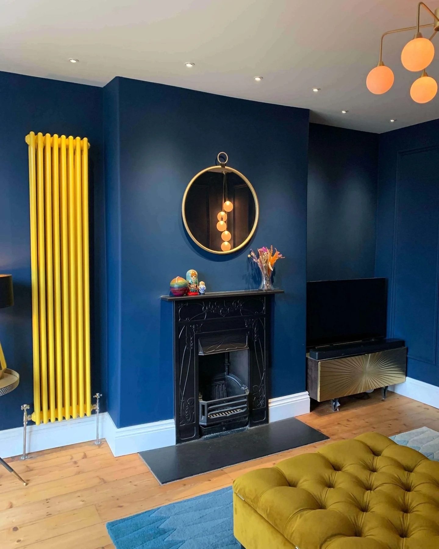 10. Navy Walls with Mustard Detailing and Modern Decor (Navy Blue Living Room Ideas)