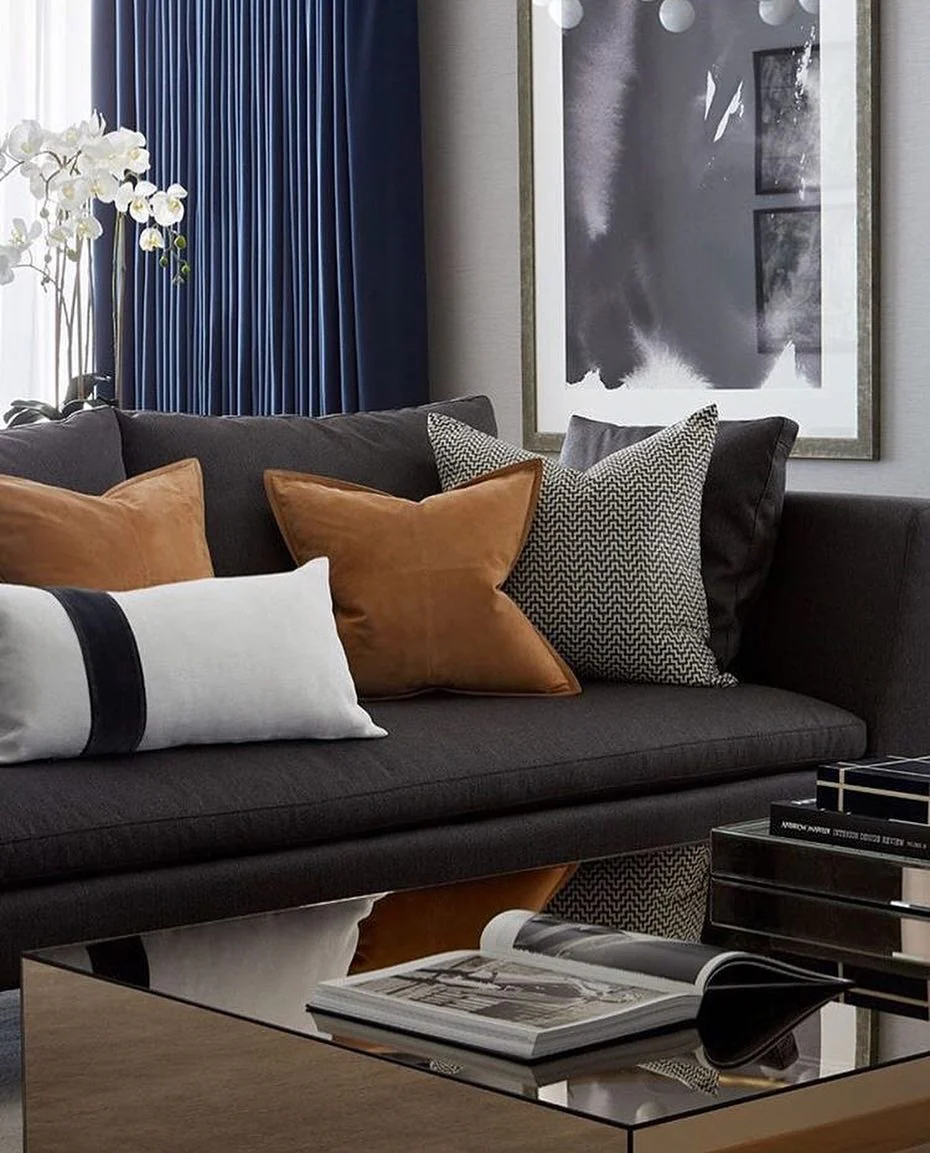 15. Charcoal Sofa with Navy Drapery and Cognac Accents (Masculine Living Room Ideas)