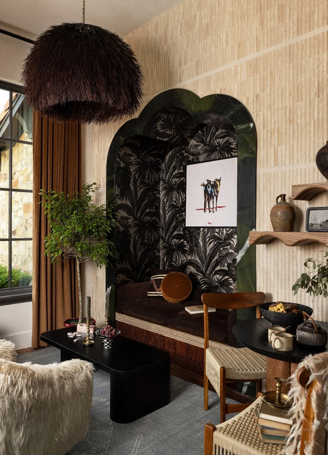 2. Textured Alcove Retreat with Botanical Black Wallpaper (Brown and Black Living Room Ideas)