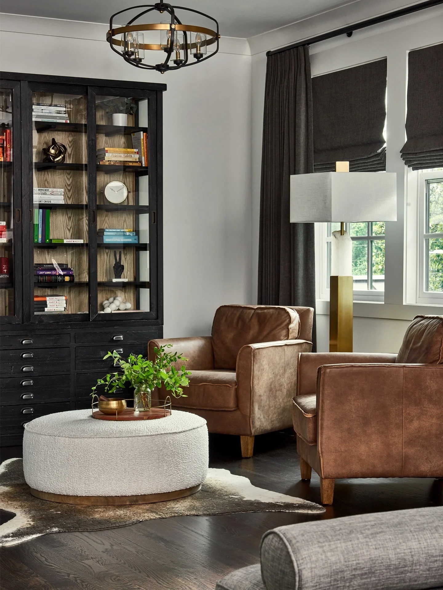 4. Classic Study-Inspired Living Room with Cognac Leather (Brown and Black Living Room Ideas)