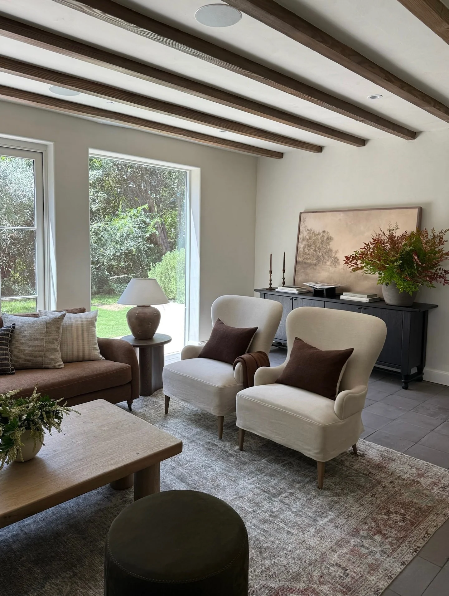 11. Soft Neutrals with Warm Brown Seating and Black Accents (Brown and Black Living Room Ideas)