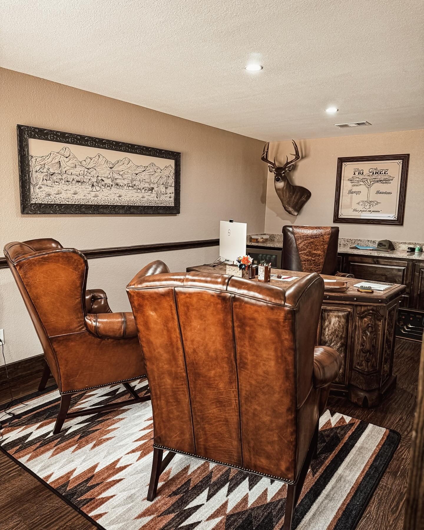 2. Saddle-Brown Executive Office with Southwestern Rug Design (Rustic Office Ideas)