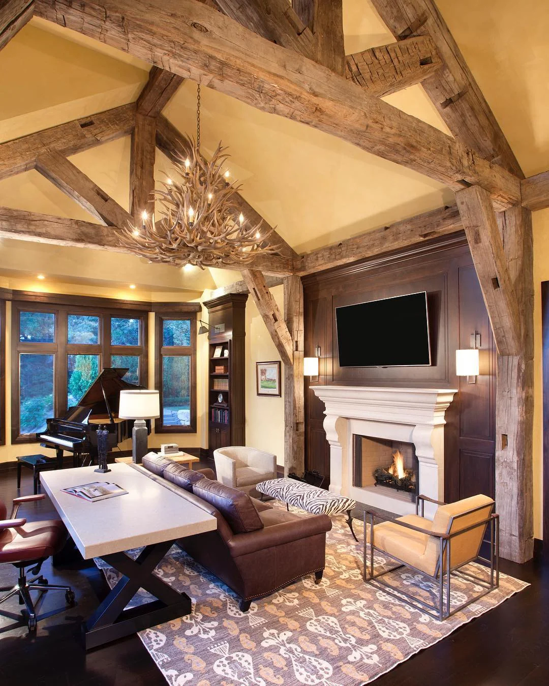 5. Antler Chandelier Lodge Office with Grand Timber Beams (Rustic Office Ideas)