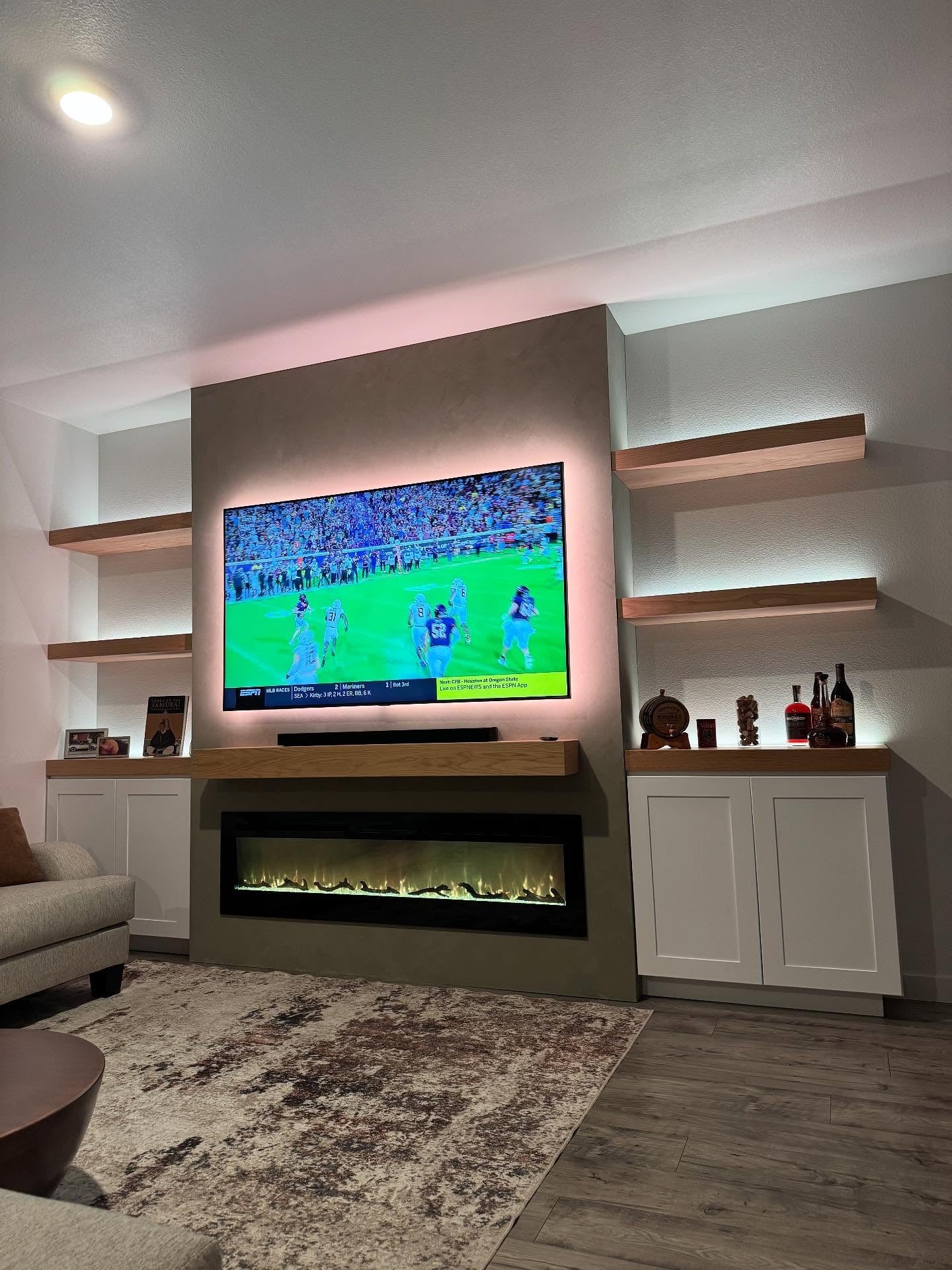 4. Warm Contemporary Fireplace Wall With Floating Shelves (Living Room Tv Ideas)