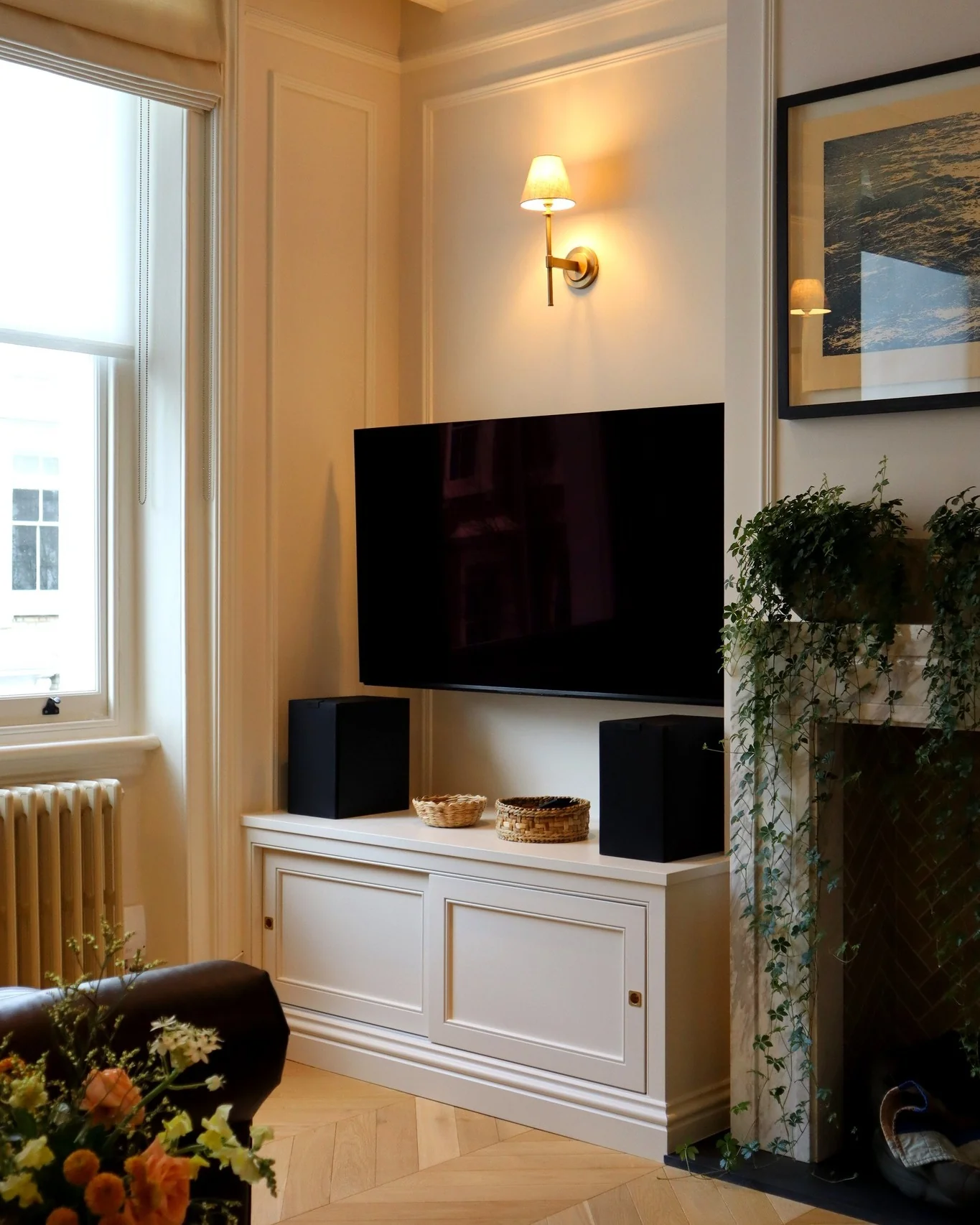 5. Classic Cream Cabinetry With Sophisticated Wall Lighting (Living Room Tv Ideas)