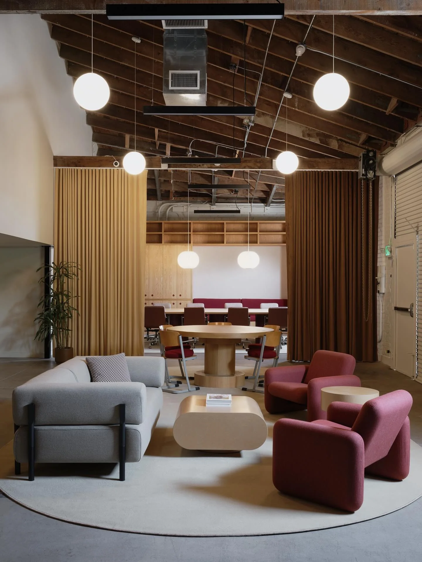 10. Industrial Warmth with Modern Geometry (Lounge Office Room Ideas)