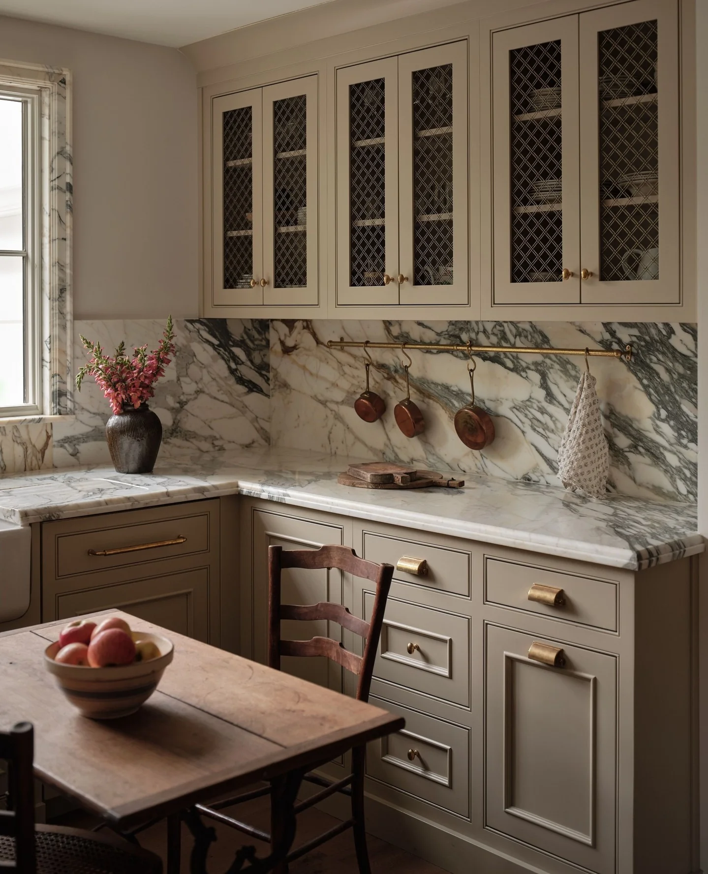 10. Timeless Stone and Brass Classic (Small Kitchen Table Ideas)