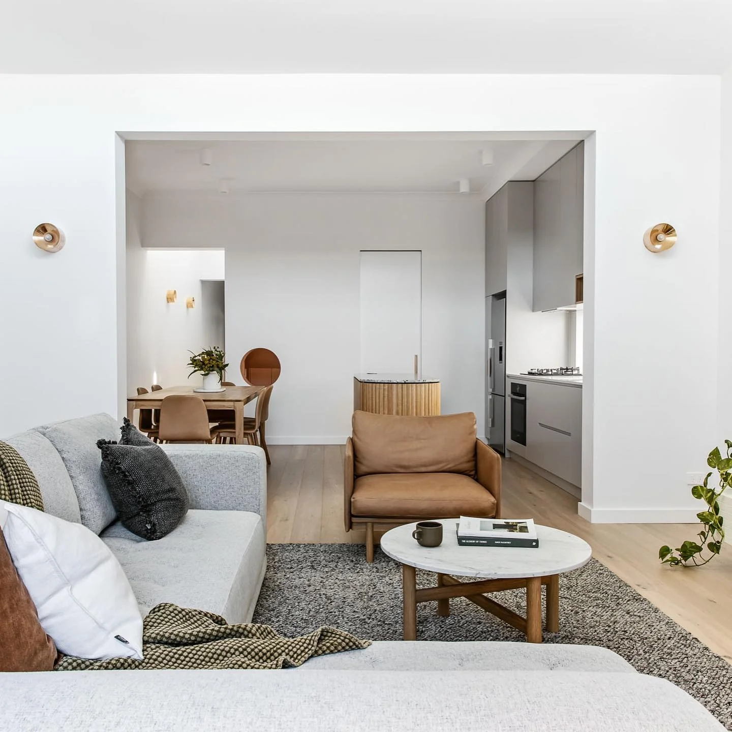 13. Minimalist Comfort in Warm Neutrals (Kitchen and Living Room Ideas)