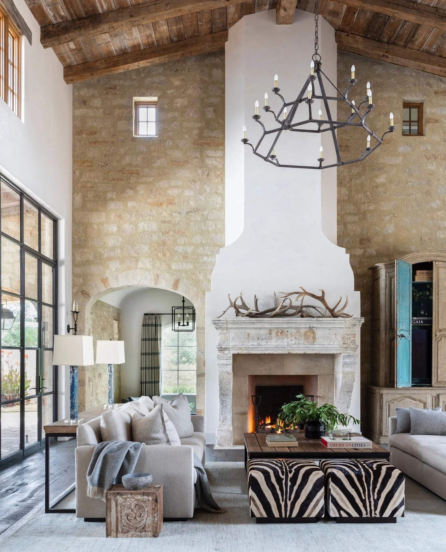 14. Rustic Stone Elegance with Global Character (Open Living Room Ideas)