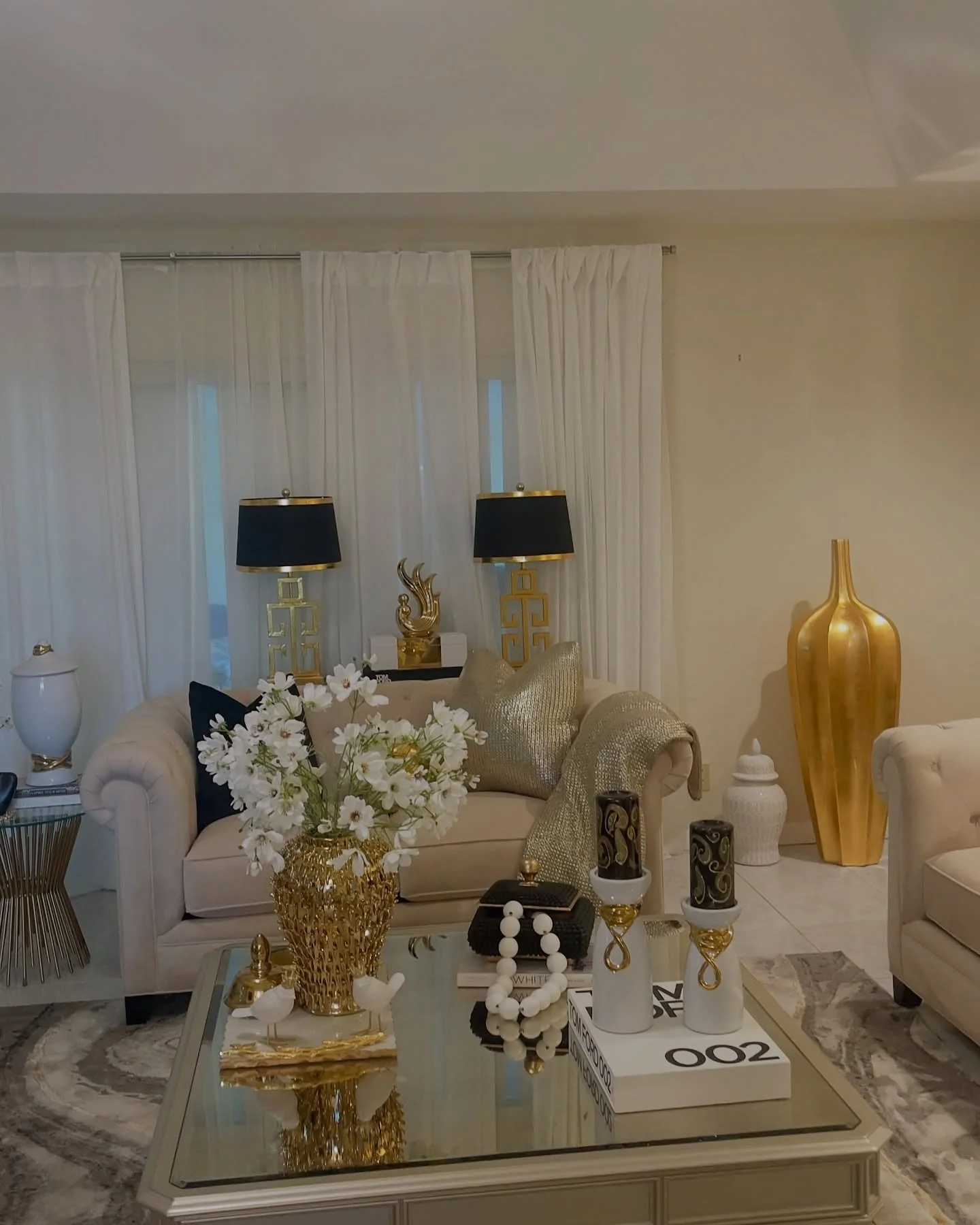 10. Regal Accents in Classic Cream and Gold (White and Gold Living Room Ideas)