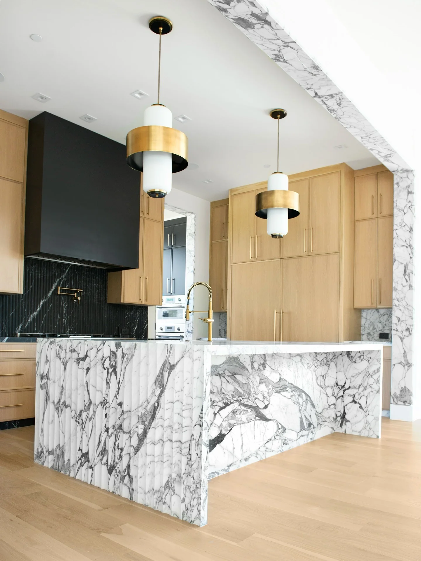 4. Sculptural Stone and Sleek Geometry (Countertop Ideas for Kitchen)