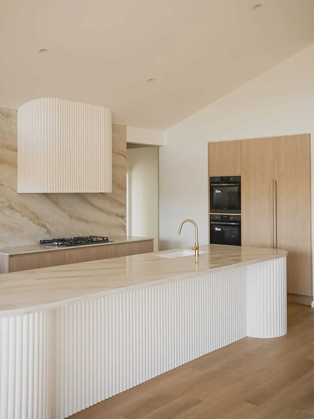 12. Textured Neutrals and Sculptural Stone (Countertop Ideas for Kitchen)