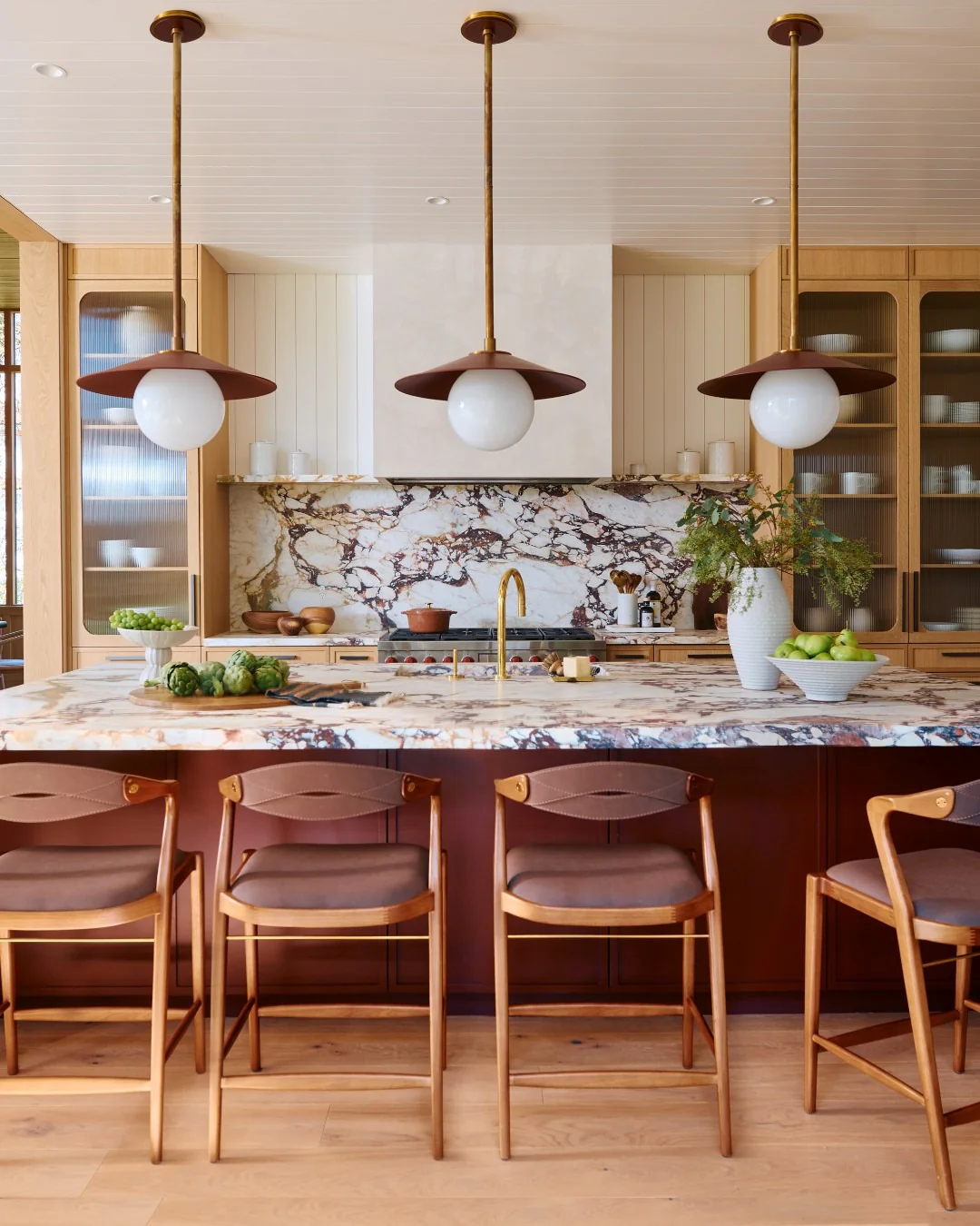 11. Terracotta Tones and Dramatic Marble (Countertop Ideas for Kitchen)