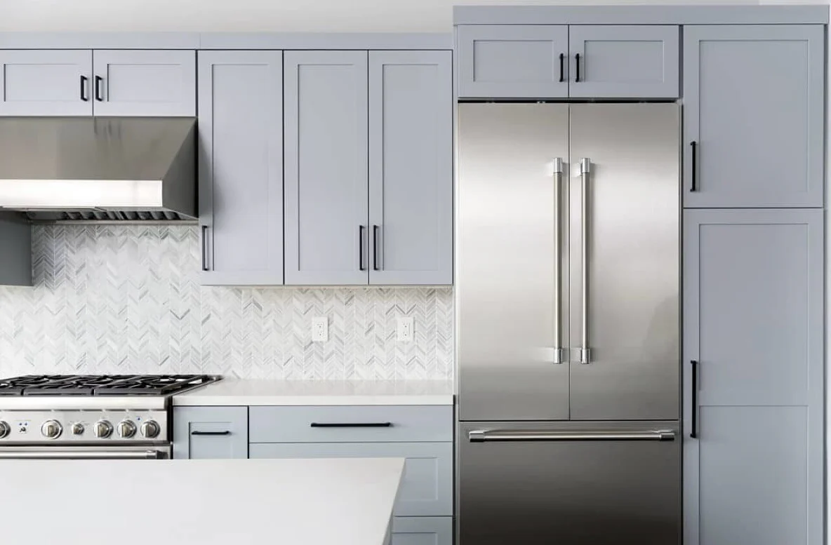 5. Soft Blue-Gray Herringbone Chic (Gray Kitchen Backsplash Ideas)