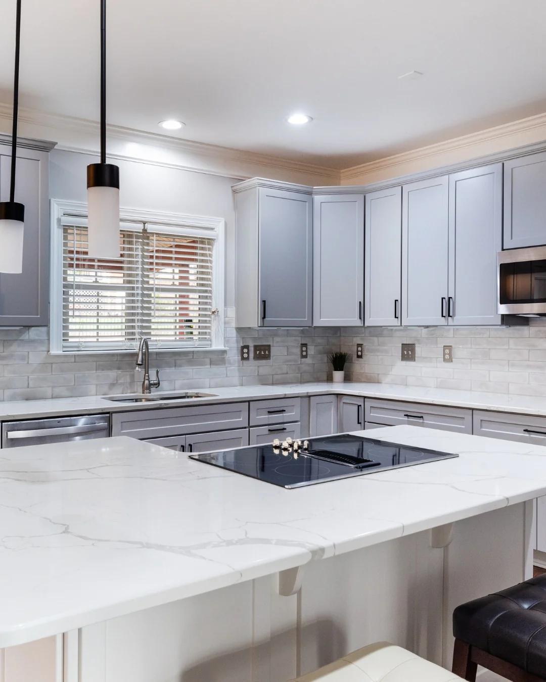 6. Marble-Inspired Sophistication with Subtle Gray Veins (Gray Kitchen Backsplash Ideas)