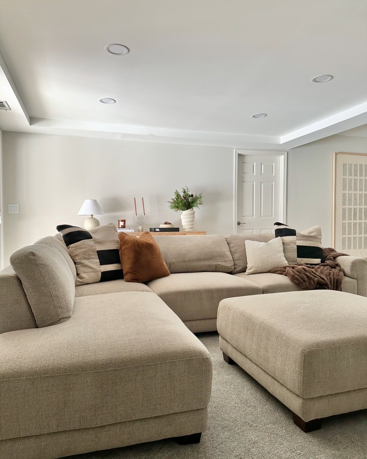 13. Layered Comfort in Warm Taupe (Aesthetic Living Room Ideas)