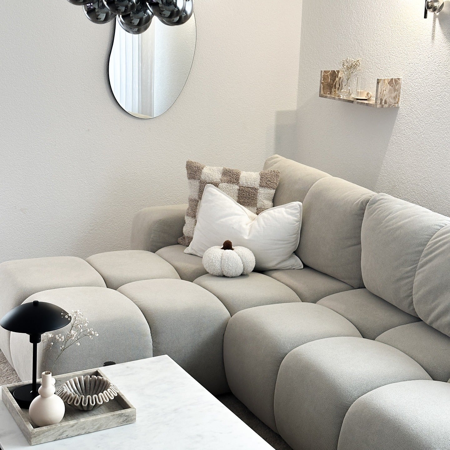 15. Compact Chic with Sculptural Softness (Aesthetic Living Room Ideas)