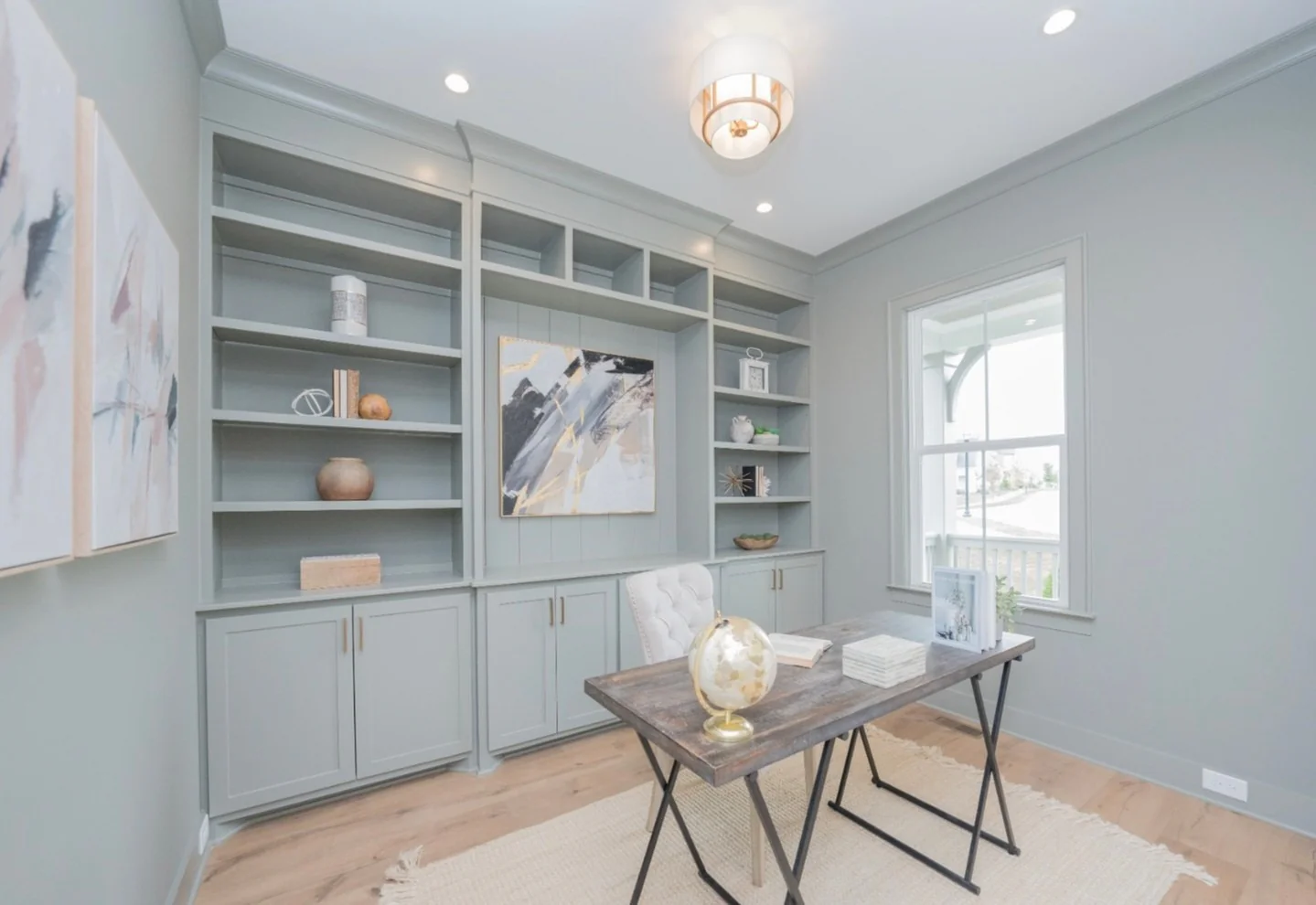 14. Soft Sage Built-In Office with Modern Art (Bright Office Ideas)