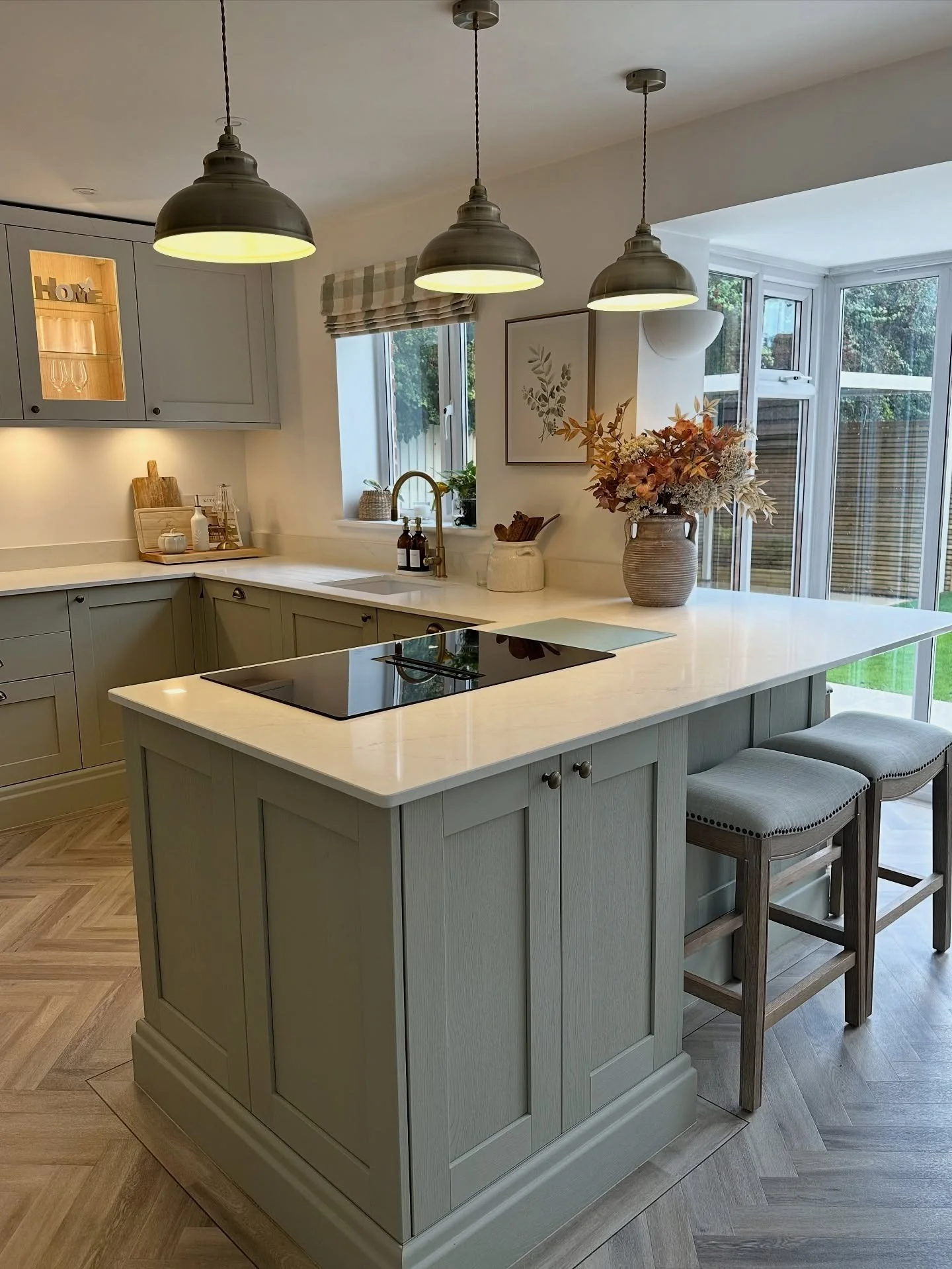 8. Soft Greens with Rustic Industrial Touches (Kitchen Lighting Ideas)