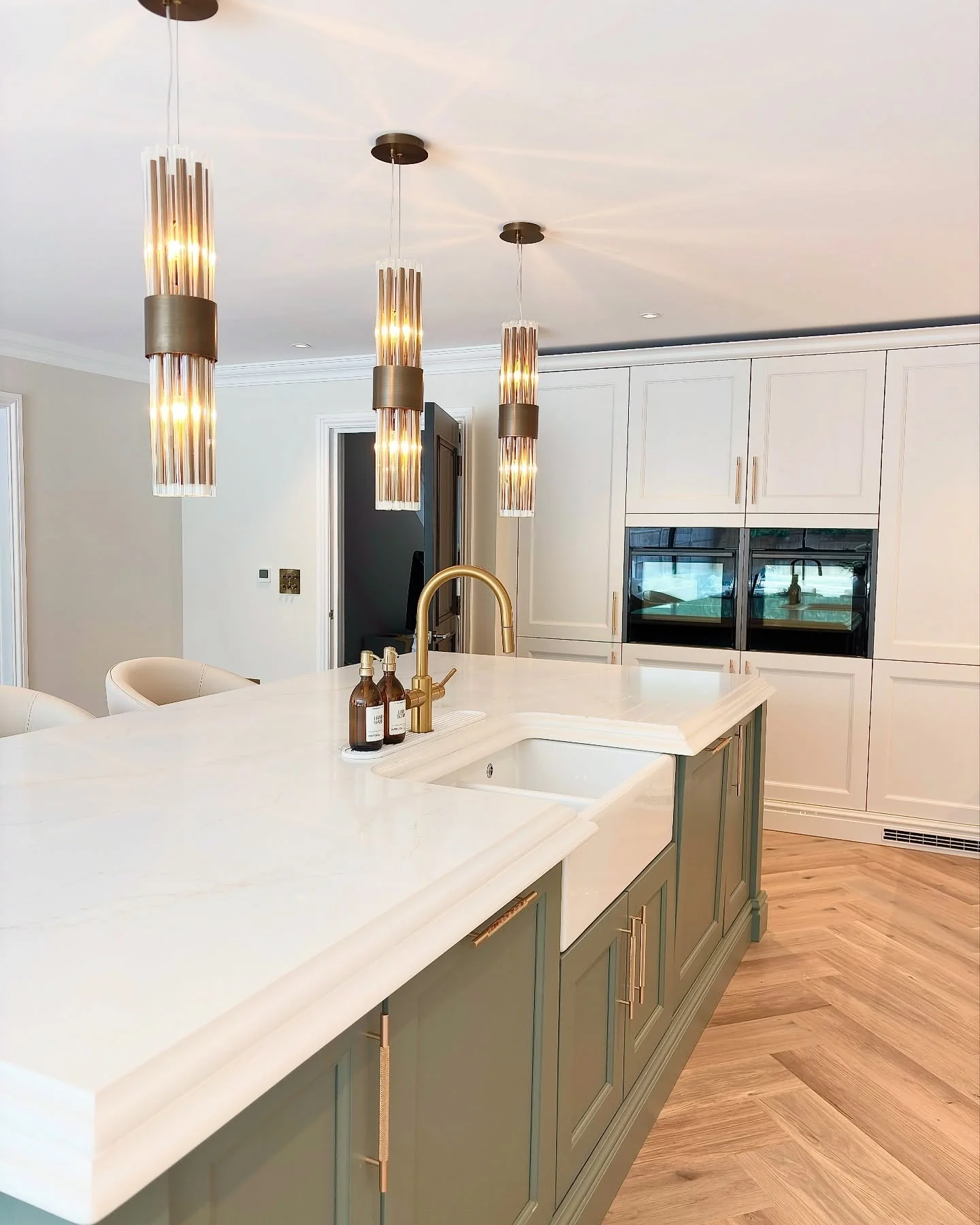 12. Warm Brass and Soft Sage Harmony (Kitchen Lighting Ideas)