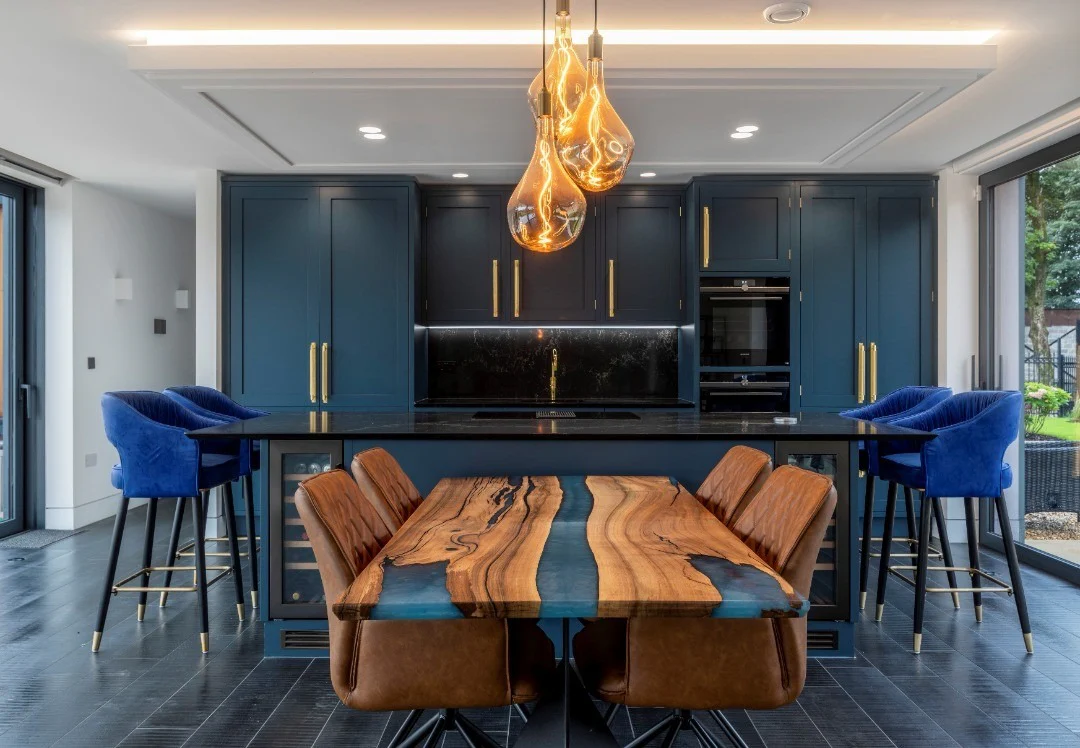 12. Dark Blue and Walnut Fusion with Bold Lighting (Dark Blue Kitchen Ideas)