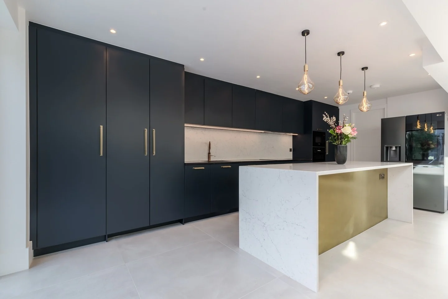 14. Modern Minimalism with Gold Accents (Dark Blue Kitchen Ideas)