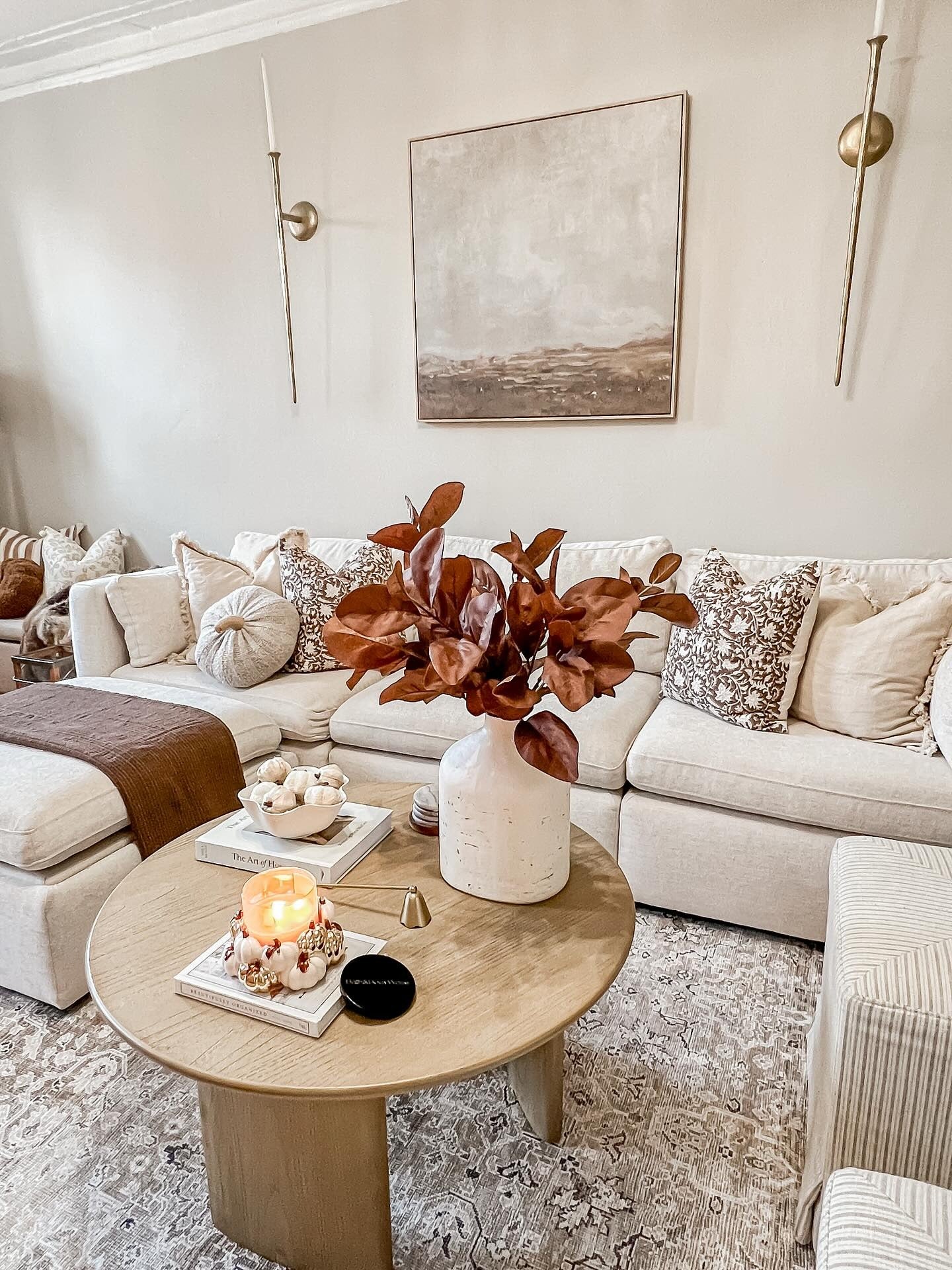 9. Neutral Tones with Burnt Accents (Fall Living Room Decor Ideas)