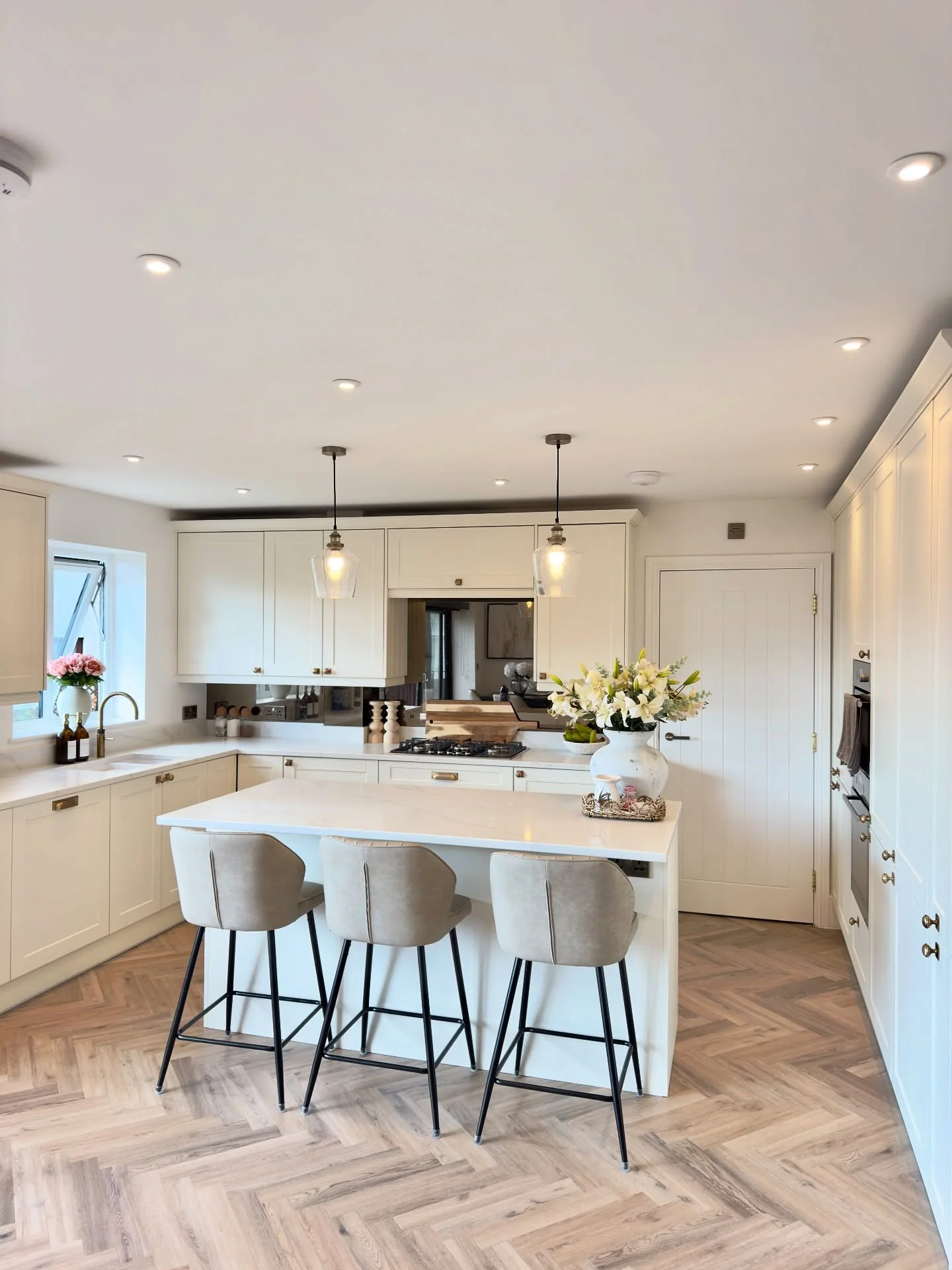 13. Elegant White Kitchen with Herringbone Flooring (Small White Kitchen Ideas)