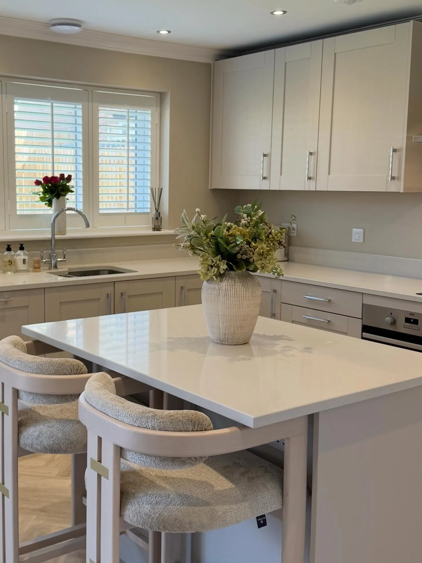 11. Soft Beige-White Kitchen with Cozy Seating (Small White Kitchen Ideas)