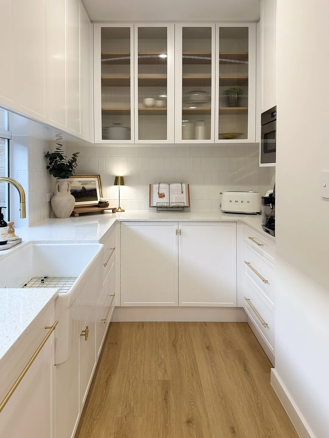 15. Compact White Kitchen with Brass Detailing (Small White Kitchen Ideas)