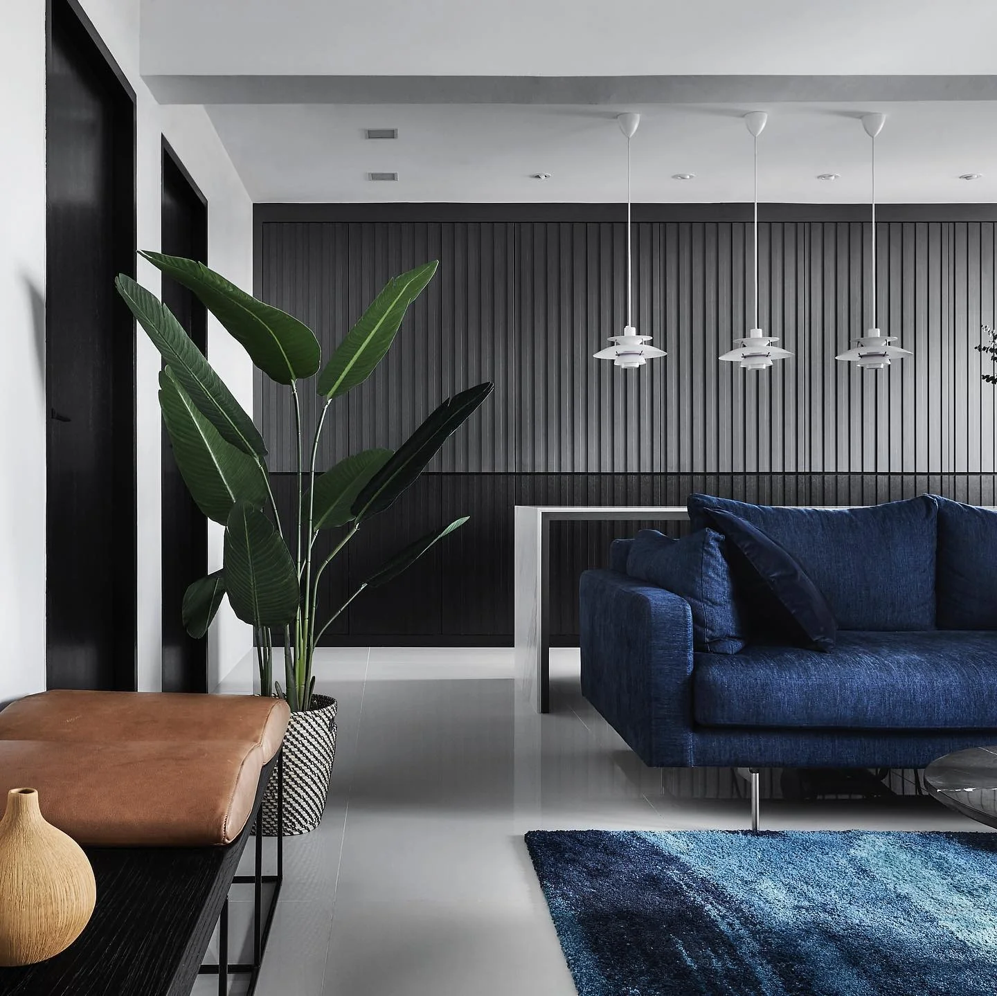 2. Bold Contrast with Navy and Charcoal (Gray and Blue Living Room Ideas)