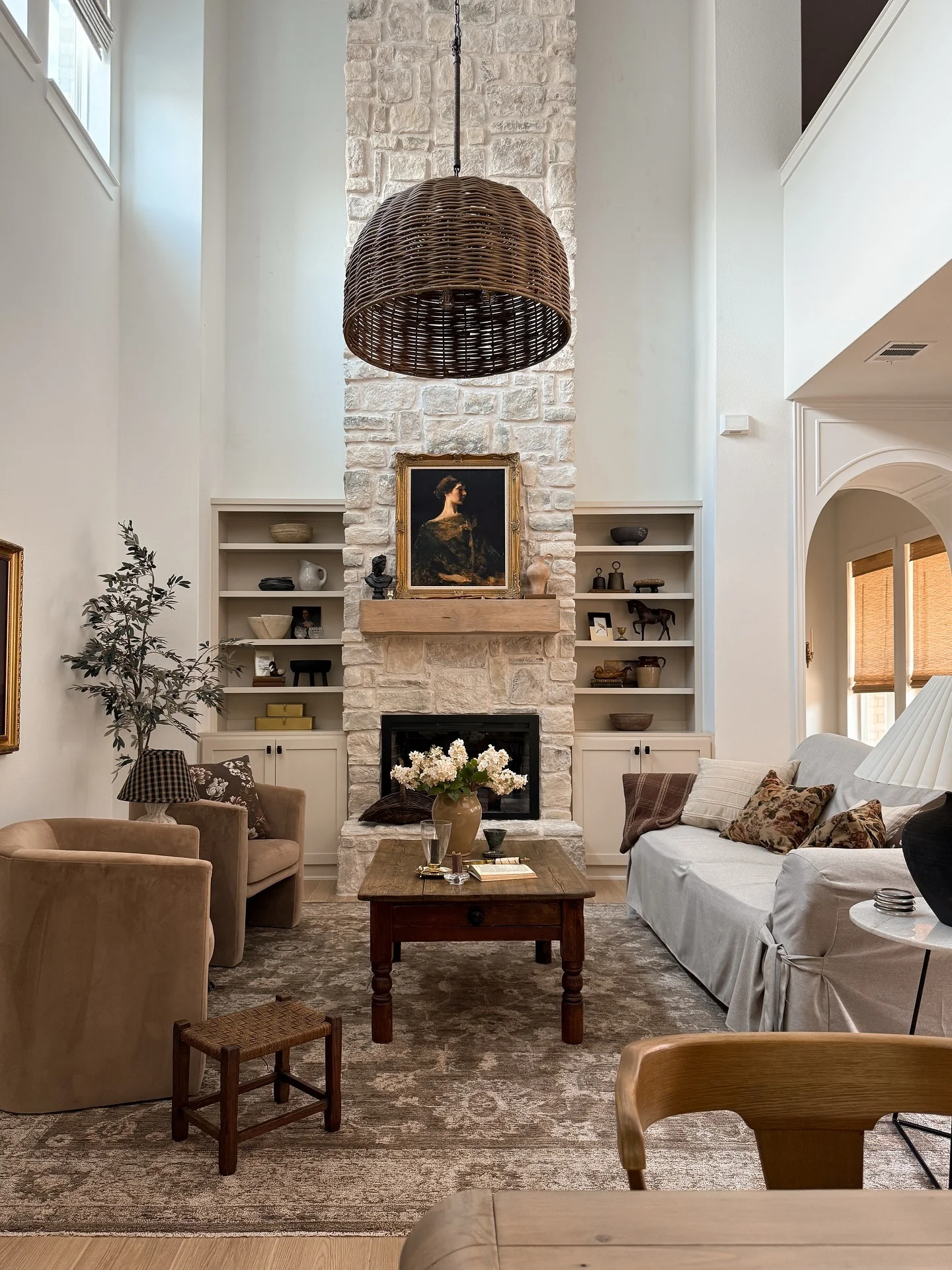 2. Stone Fireplace with Rustic Elegance (Brown and Gold Living Room Ideas)