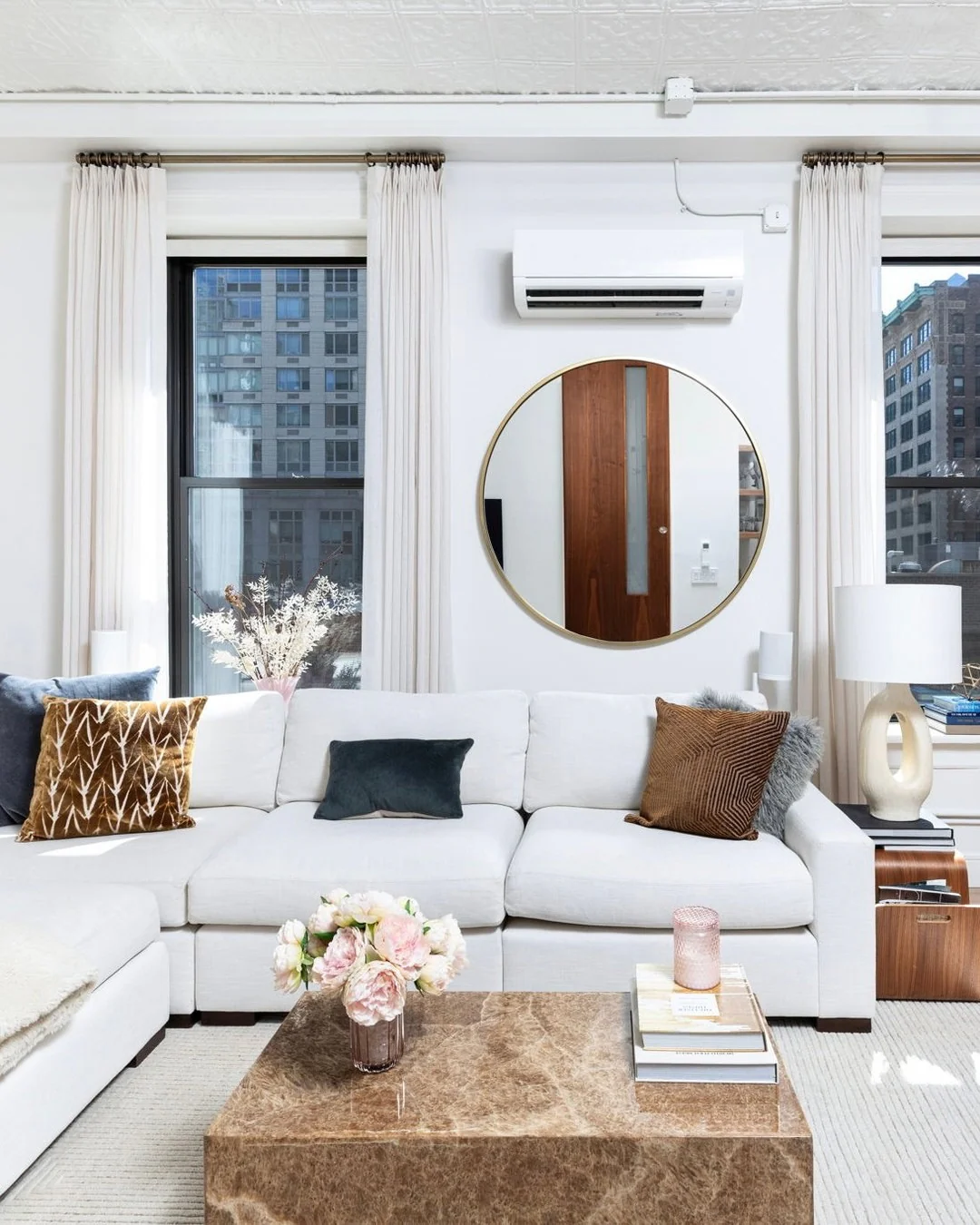 13. Bright Neutrals with Textured Accents (Condo Living Room Ideas)