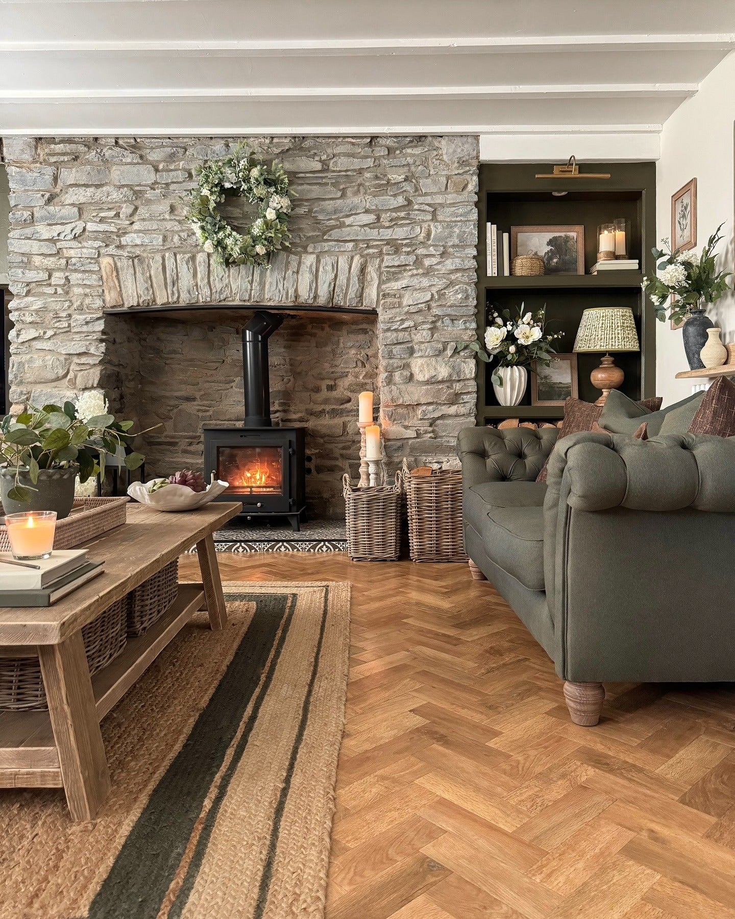 5. Cottage-Style Stone Fireplace with Wood Stove (Fireplace Living Room Ideas)