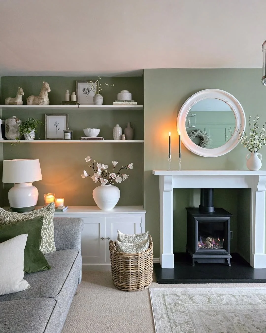 9. Soft Green Fireplace Wall with Built-In Shelving (Fireplace Living Room Ideas)