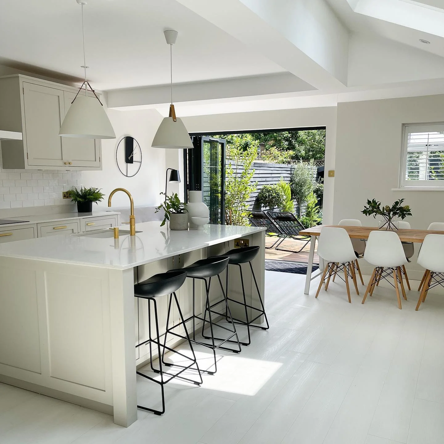 2. Soft Neutrals with Gold Accents (White Kitchen Floor Ideas)