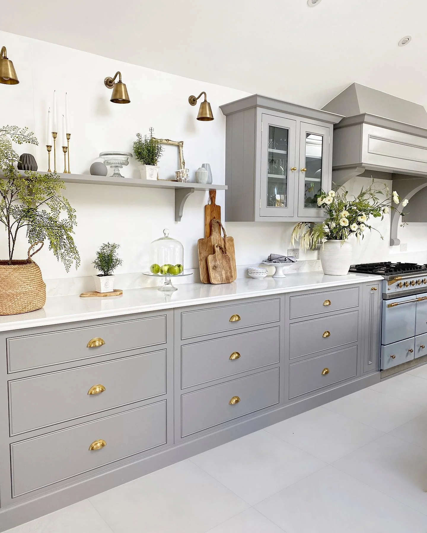 4. Elegant Grey and Brass Detailing (White Kitchen Floor Ideas)