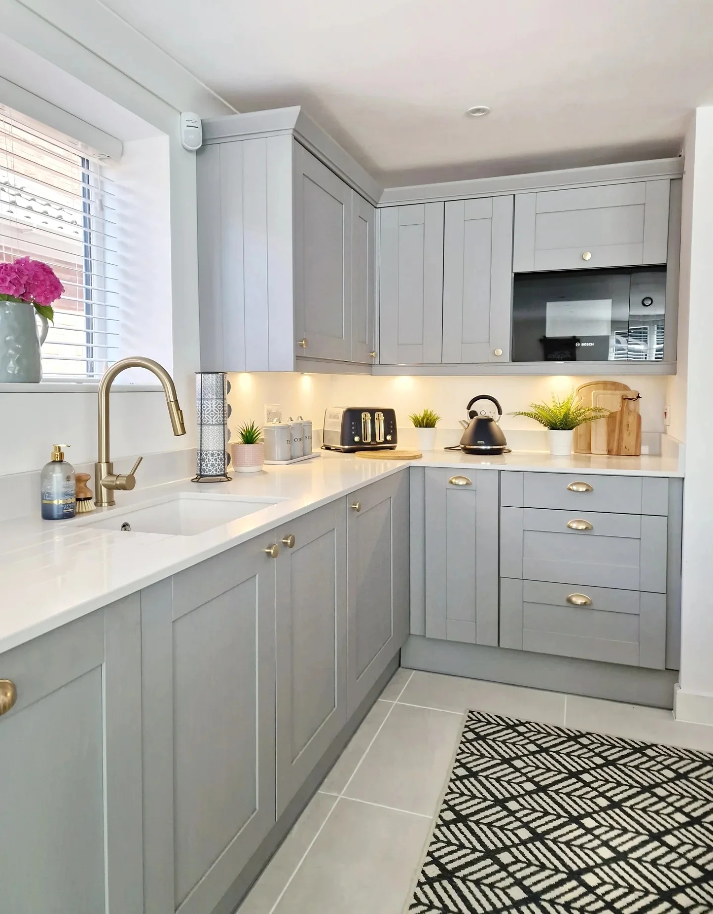 11. Compact Grey Elegance with White Flooring (White Kitchen Floor Ideas)