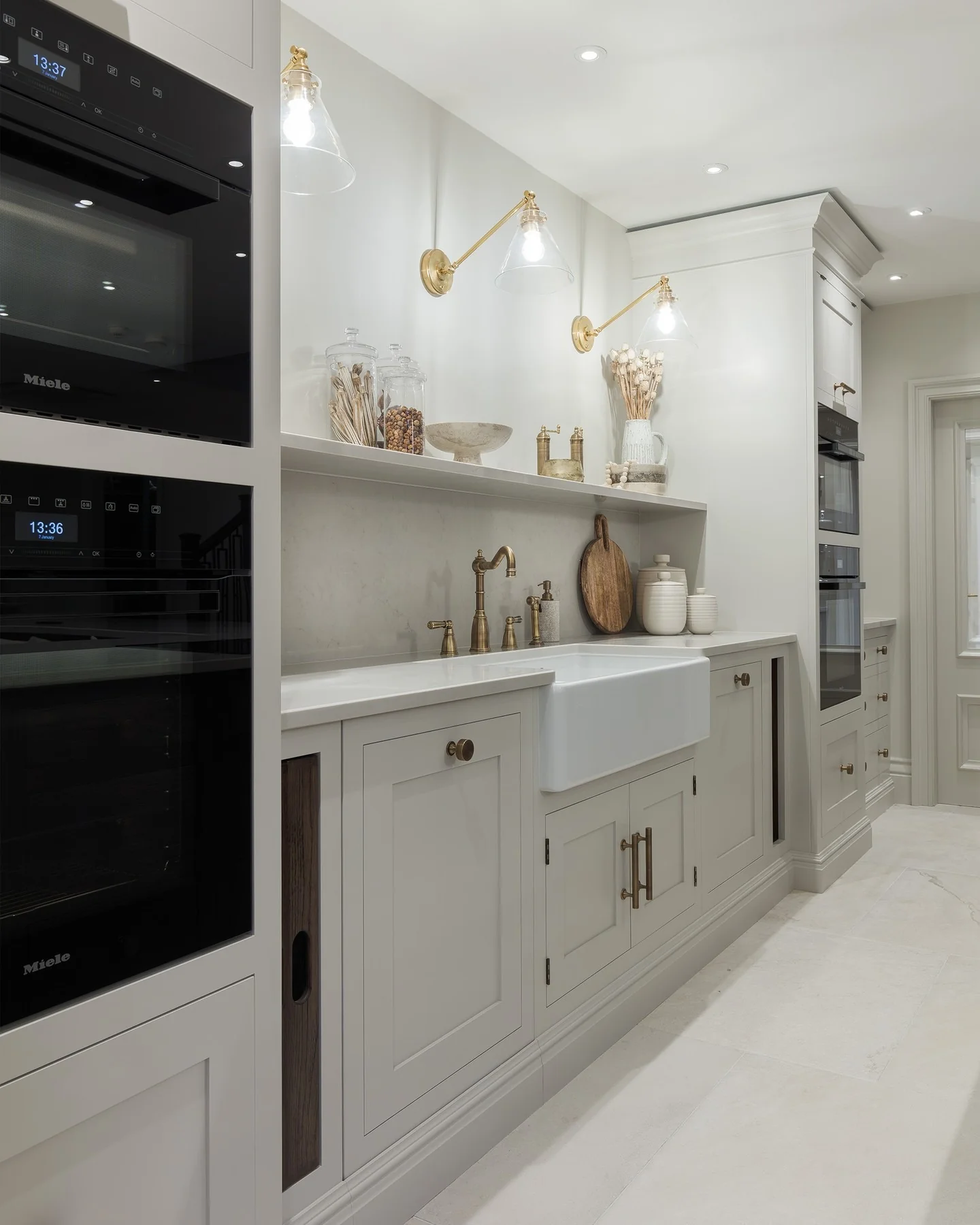 9. Refined Neutrals with Brass Fixtures (White Kitchen Floor Ideas)