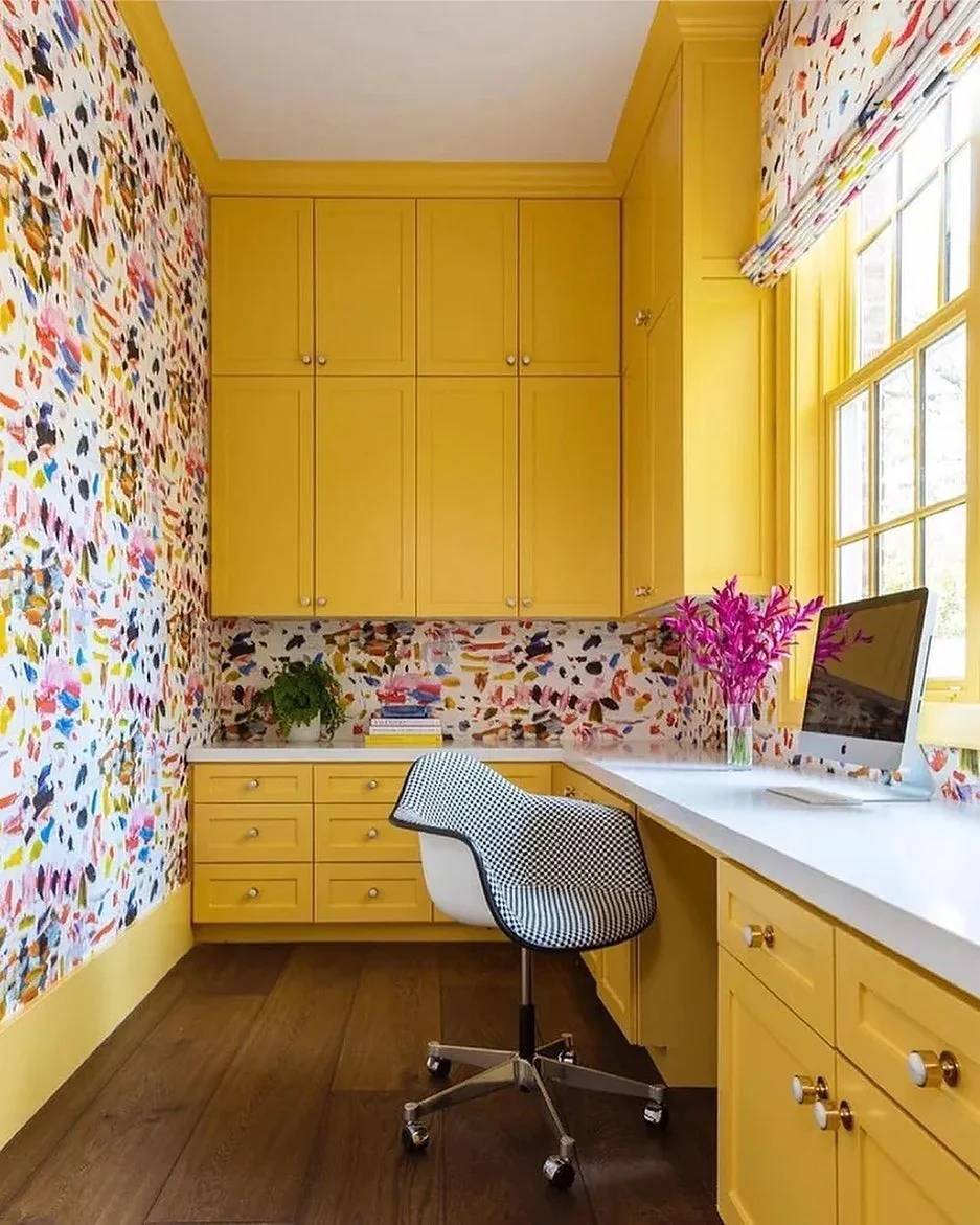 13. Vibrant Yellow Built-In Office with Playful Wallpaper (Yellow Office Ideas)