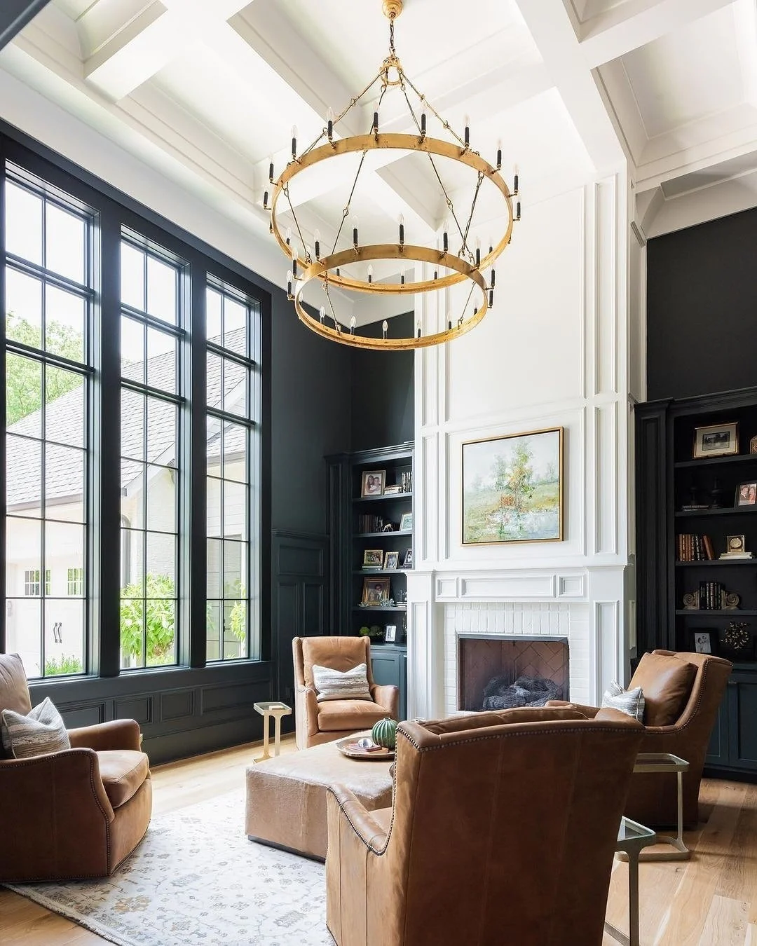 8. Timeless Contrast with Leather and Black Accents (Living Room Chandelier Ideas)